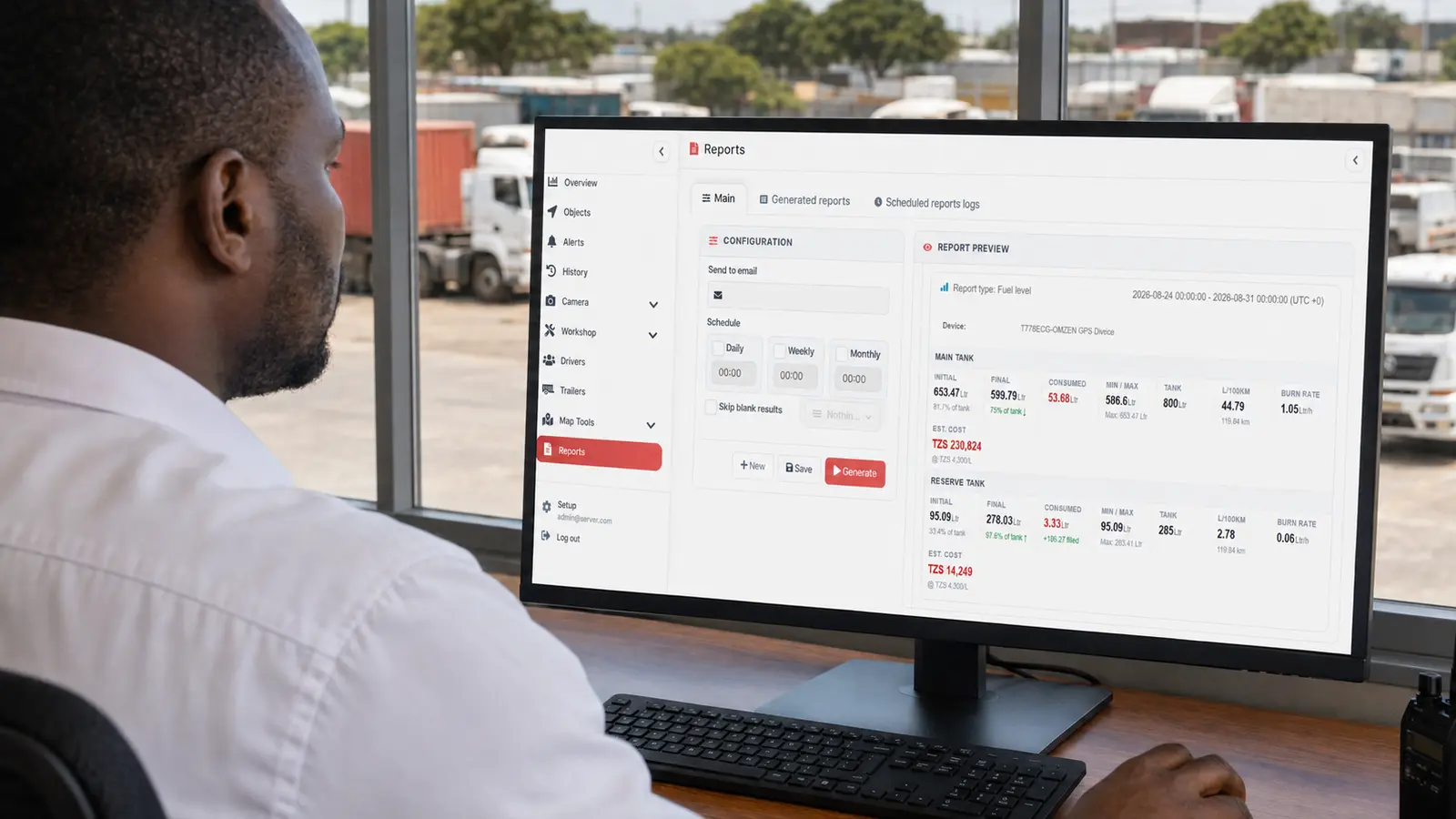 Fleet manager reviewing vehicle tracking reports and fuel information in Tanzania
